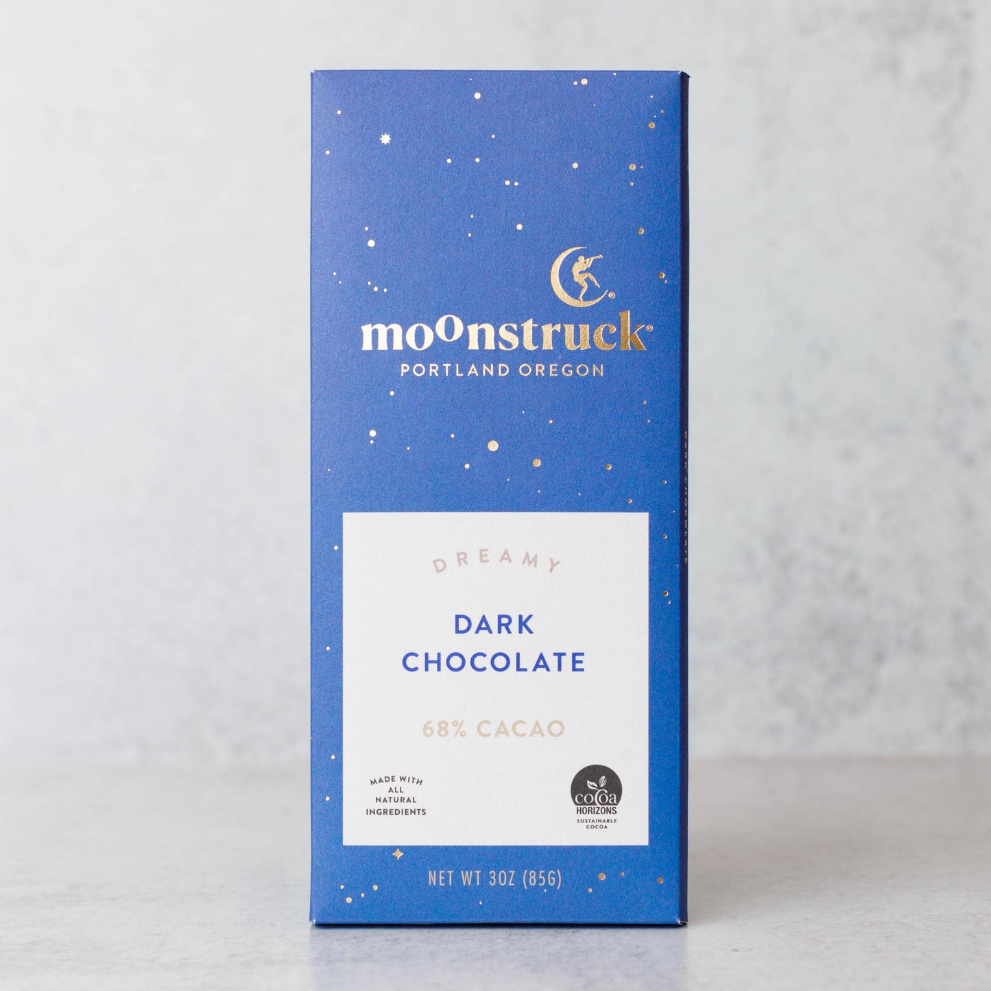 Moonstruck dark chocolate bar packaging on a light gray background