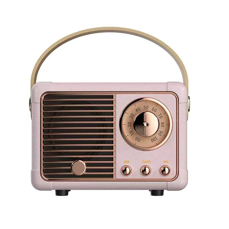 Vintage-style radio with pink body and rose gold accents on a white background